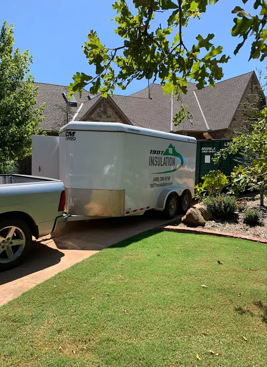1907 Insulation - fiberglass insulation is cost-effective and a durable option for home insulation - 1907 Insulation work truck and trailer at a client's house in the OKC area.